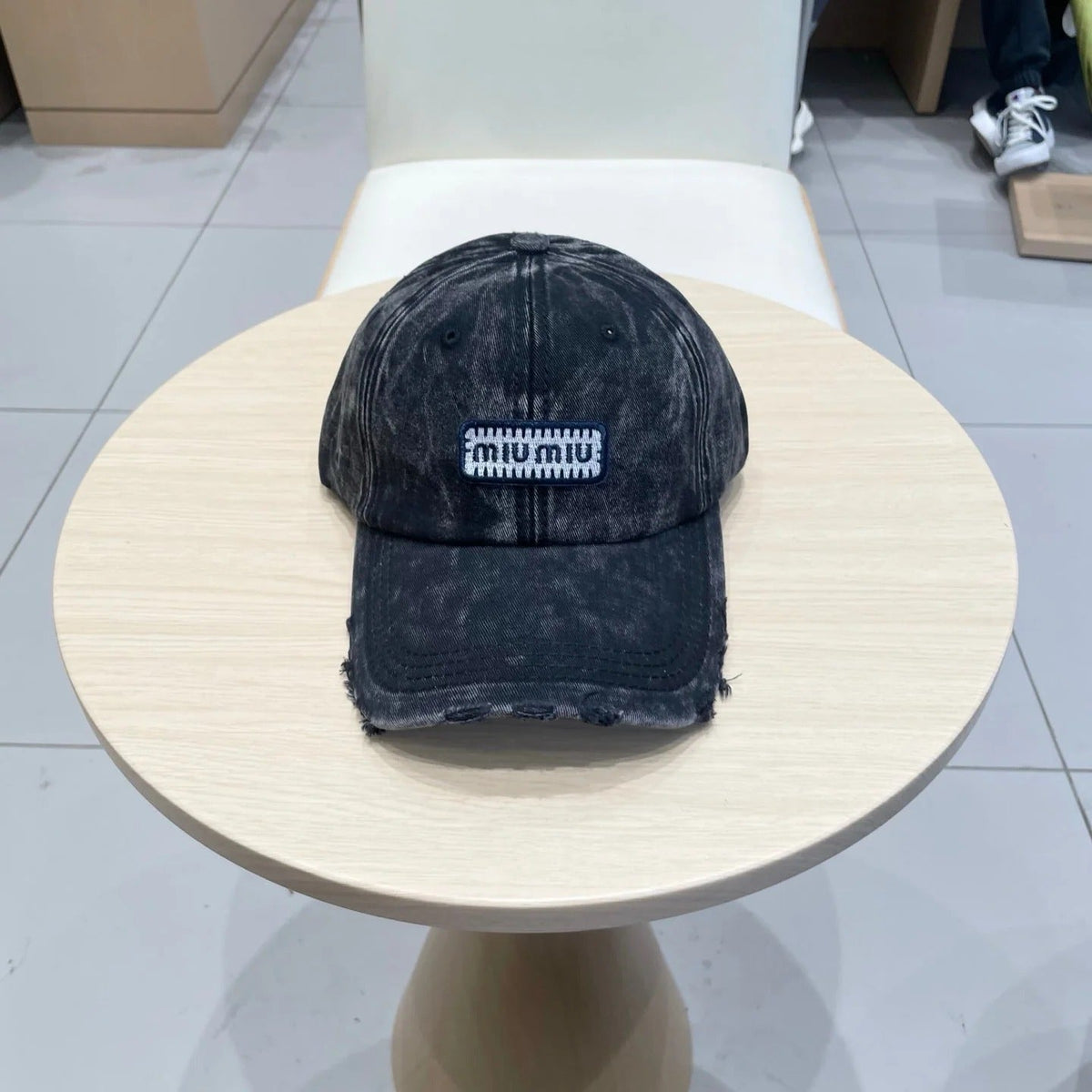 MM DISTRESSED FABRIC BASEBALL CAP IN BLACK WITH EMBROIDERED LOGO